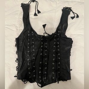 Fully adjustable tie corset. Cover panel in back.